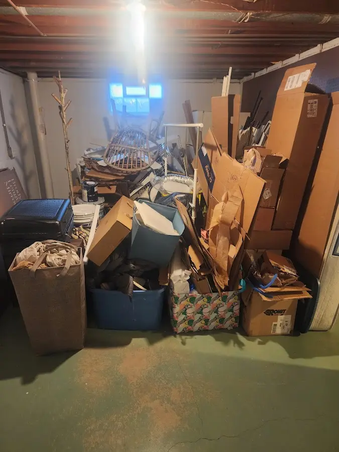 Roll-off dumpster container at job site for 20 Yard Dumpster Rental in Hancock